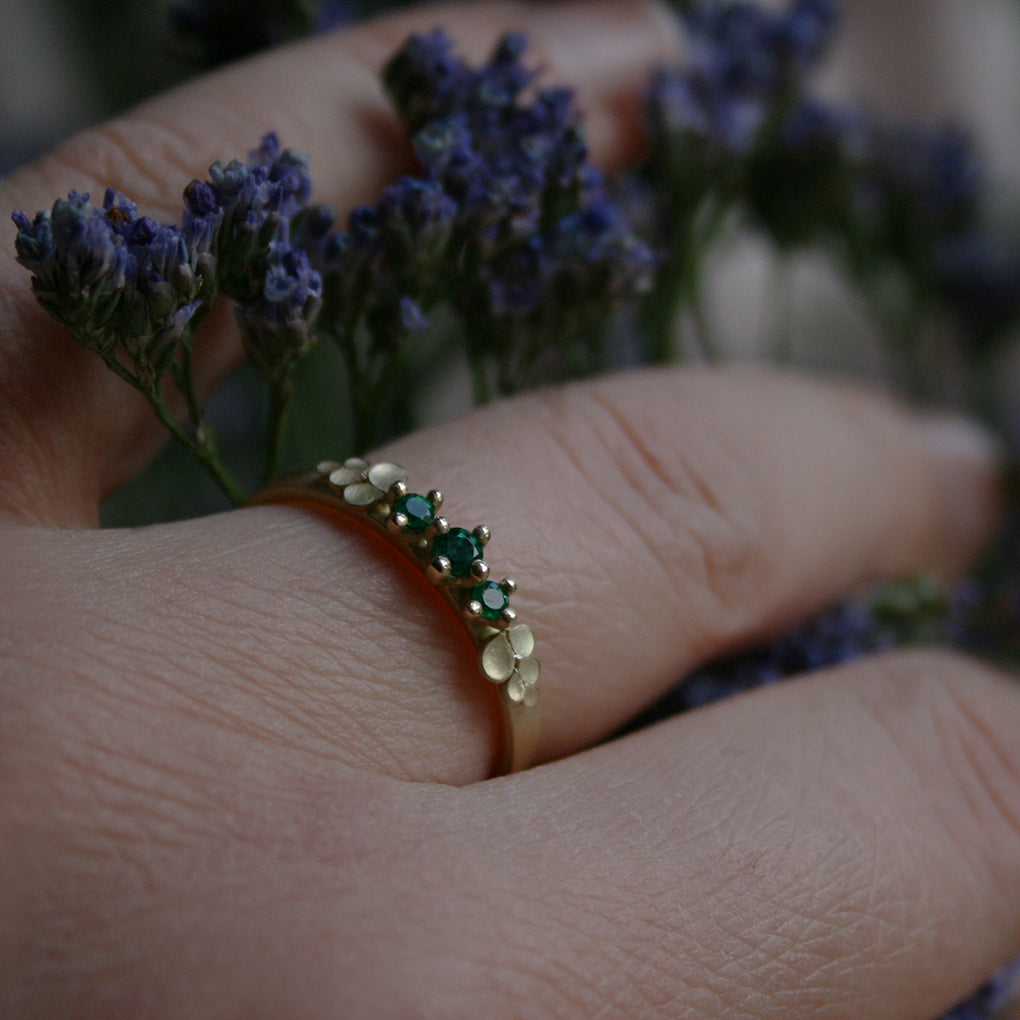 Dahlia Bow 18ct. Gold three Stone Emerald Ring