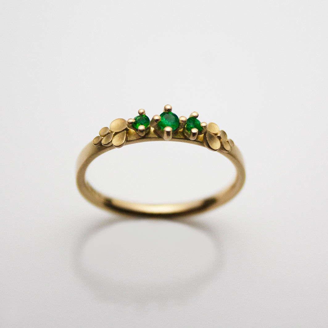 Dahlia Bow 18ct. Gold three Stone Emerald Ring